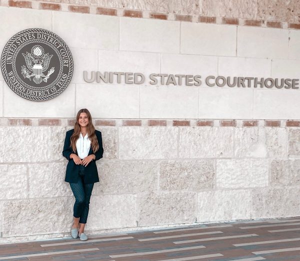 2.2 Beyond the Classroom 5 Taylor Needleman, a Criminology major who interned with the U.S. Marshals Service in the summer of 2022, stands in front of the United States Courthouse where she worked every day